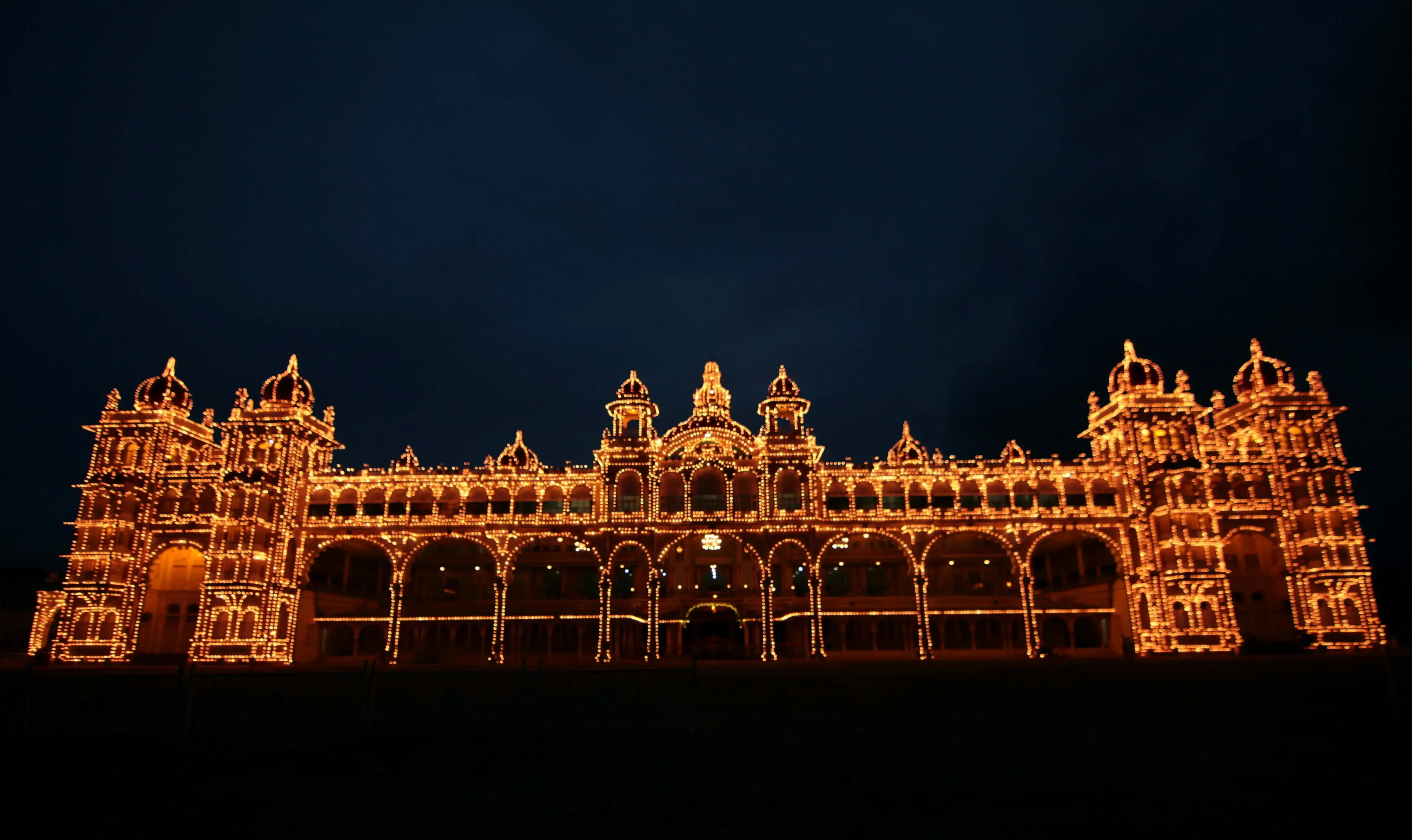 Mysore Palace illuminated at dusk